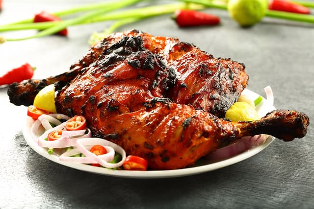 52. TANDOORI CHICKEN (Dark Meat Only) Half 13.95 or Full 21.95